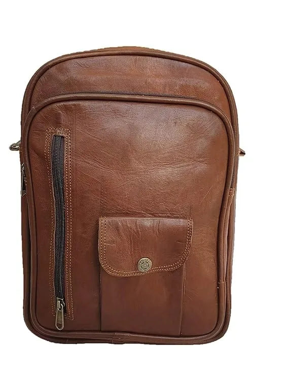 A brown leather vintage unisex backpack with a solid pattern, featuring adjustable straps and a buckle closure.